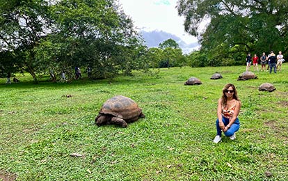 A turtle in the reserve El Chato whit a person.